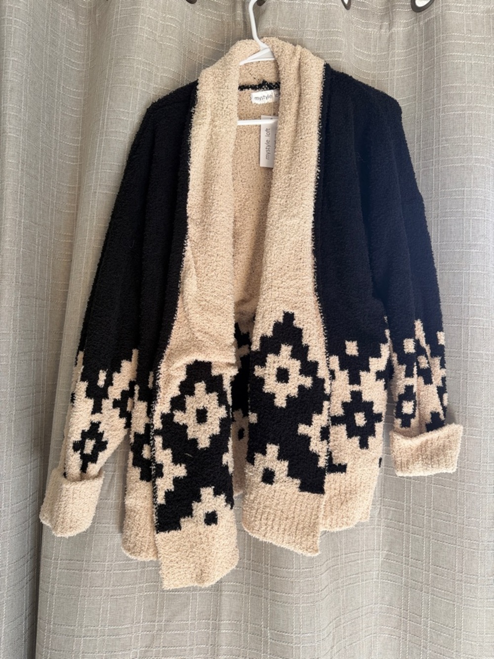 cozy, textured knit cardigan from the brand Mystyle Loft